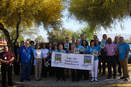 Healthcare team holding Donate Life banner