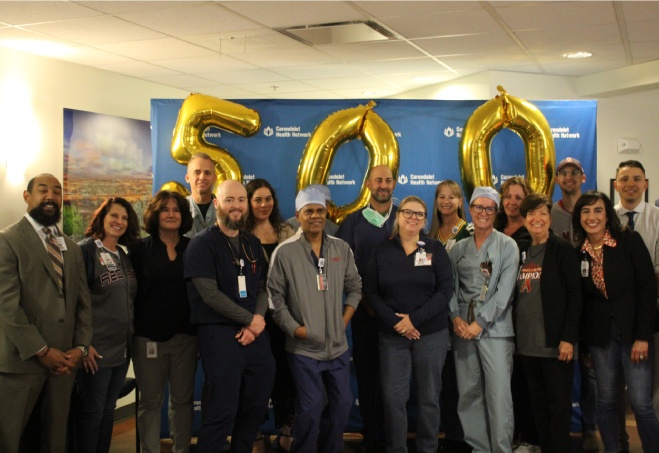 Healthcare team celebrating 500 milestone achievement